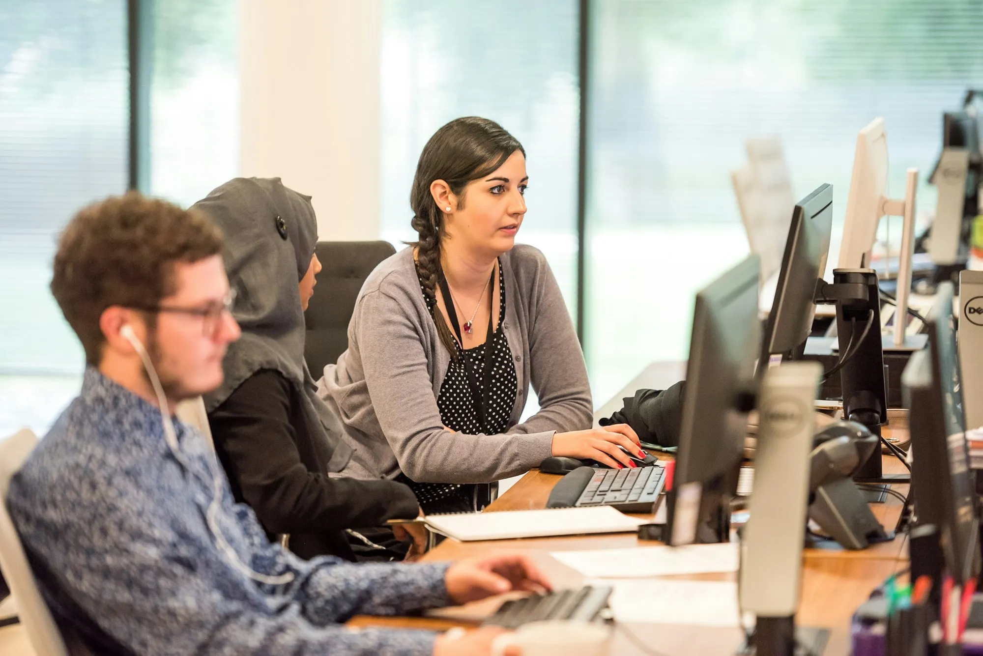 Office staff working at their computers in an open-plan room